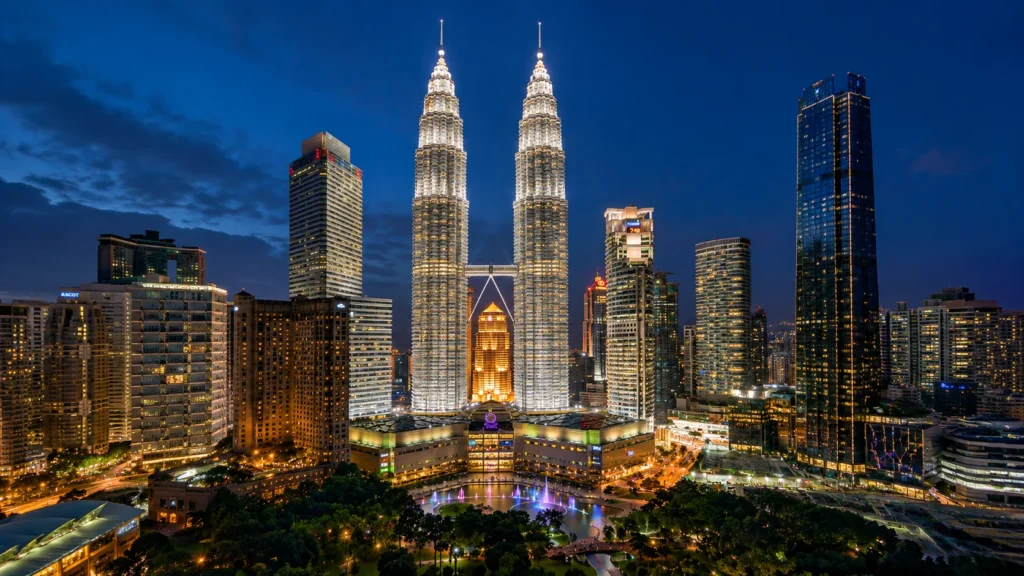 Petronas Twin Towers illuminated at night in Kuala Lumpur Malaysia