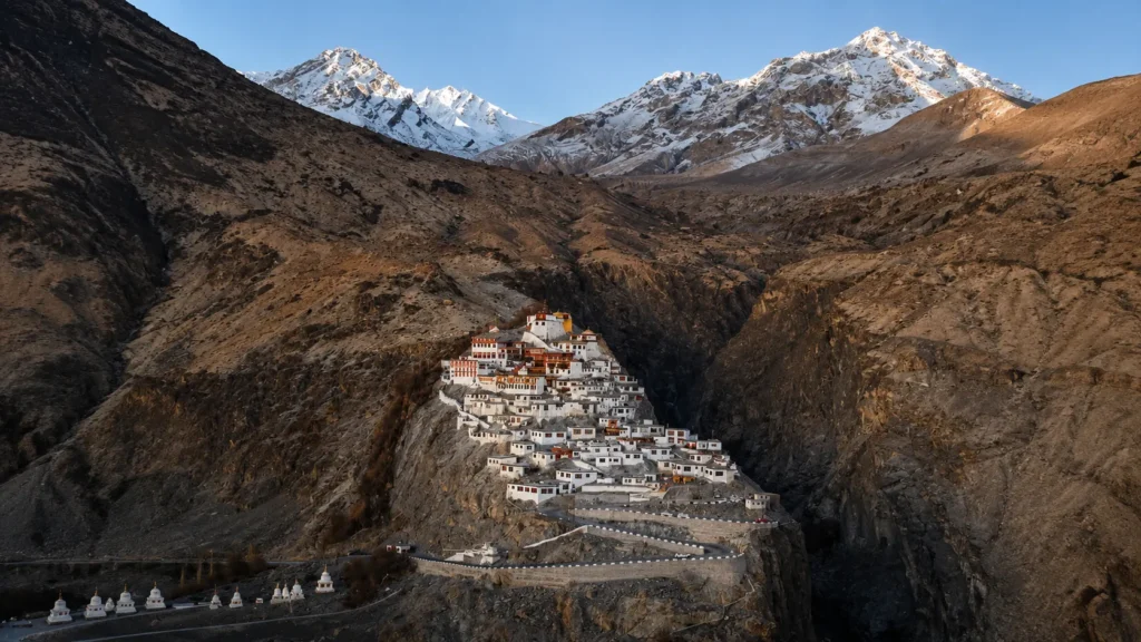 Bikers riding through snow-covered mountains during a Ladakh Road Trip Guide adventure