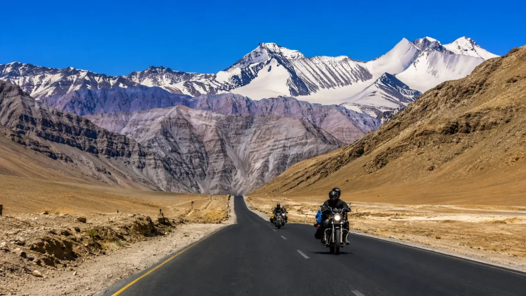 Motorcyclists on a scenic highway in the ultimate Ladakh Road Trip Guide