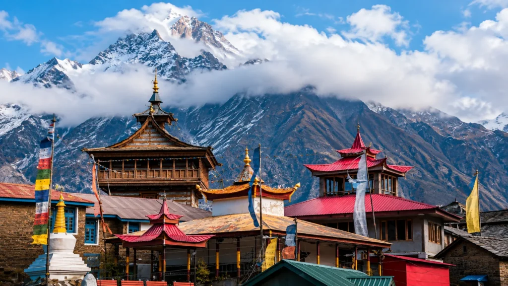 Manali Travel Guide featuring a Himalayan temple with snow-capped mountains in Himachal Pradesh